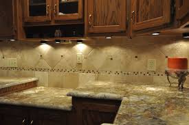 granite countertops and tile backsplash