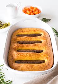 Toad in the hole or sausage toad is a traditional english dish consisting of sausages in yorkshire pudding batter, usually served with onion gravy and vegetables. Vegetarian Toad In The Hole The New Classic