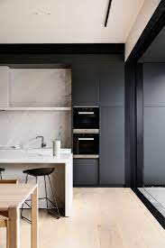 Through Subtle Shifts In Tone And Stripping Of The Non Essential Elsternwick House Sees Kitchen Inspiration Design Interior Design Kitchen Minimalist Kitchen