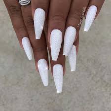 Check out these gorgeous designs, ranging from simple (dare we say, practical?) to go luxe by painting your two center nails a glitzy shade of gold, then leaving the rest a creamy white. 23 Chic Ways To Wear White Coffin Nails Page 2 Of 2 Stayglam White Acrylic Nails Coffin Nails Designs White Coffin Nails