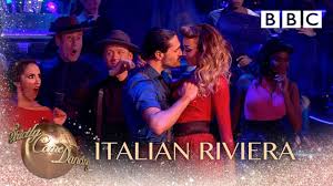 A dance competition where celebrities compete to be crowned the winner. Strictly Travels To The Italian Riviera Of The 50s Bbc Strictly 2018 Youtube
