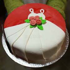 Every bridal shower needs sweets of some kind, and that's where wracking your brain for cake ideas can be daunting. White And Red Gown Bride To Be Cake