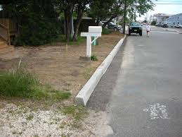 A hand tool made to match the profile of the curbface used to finish and smooth the curbface after concrete placement, but before concrete hardening. Forming A Concrete Curb Fine Homebuilding