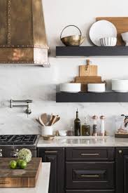 The entire faucet should be made of bronze. Copper Kitchen Accents Done Beautifully In This Navy And Marble Kitchen Brianna Michelle Interior Desig Kitchen Interior Copper Kitchen Accents Kitchen Remodel