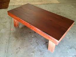 We were given a handmade redwood table with very thick wood stump legs. Reclaimed Redwood Coffee Table Rustic Modern Artisan Coffee Table Dining Table Beautiful Wood