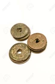Round and square are representative of flexibility and strength respectively as well as mobility and stability. Stacks Of Copper Coins The Disc Shape With A Square Hole In The Middle Is Typical Of Ancient Chinese Currencies Chinese Characters Are Visible On The Surface Of The Coins Stock Photo Picture