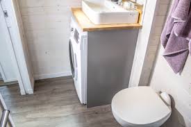 Tiny House Pops Out For Extra Space Curbedclockmenumore Arrownoyes A Bedroom And A Living Room Tiny House Bathroom Modern Tiny House Best Tiny House