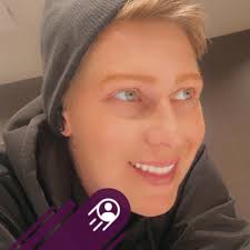 What is the meaning of the one-way sign in the photo?