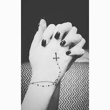 Powerful and amazing rosary tattoo designs men and women 2019. Choosing The Appropriate Angel Wings Tattoo Design Tattoos For Women Rosary Tattoo Finger Tattoos Tattoos For Women