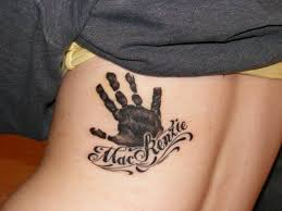 Hand print tattoo designs are not limited to people who are parents: Doing This When I Have A Kid But Without The Name And On The Ribs Http Lifestayless Blogspot Com Hand Print Tattoos Tattoos For Kids Tattoo For Baby Girl