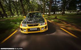 トヨタ・カローラ, toyota karōra) is a line of subcompact and compact cars manufactured by toyota. Hd Wallpaper Mitsubishi Evolution Evo Road Trees Hd Black And Yellow Toyota Corolla Wallpaper Flare