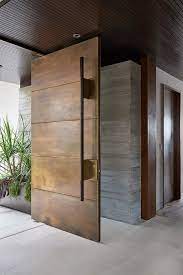 homes with most beautiful metal door entrances aluminr bespoke luxury metal door manufacturers entrance door design door design modern house designs exterior