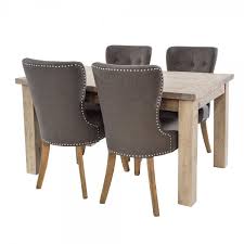 Nice table and chair set but the way that it was assembled for shipping resulted in scratches on the table and a mangled mess under the table from the 50 plus industrial staples used to hold the legs during shipping. Grey Washed Wood Dining Table Chairs From Curiosity Interiors