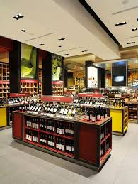 Adding Warmth Through Simple Visuals Wine Store Design Wine Store Wine Shop Interior