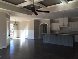 White cabinets, white counters, and a soft gray backsplash. Sherwin Williams Worldly Gray Alabaster Cabinets And Trim Dovetail Island Visual Comfort And Kichler Lighting Ja Worldly Gray Updating House Houston Houses