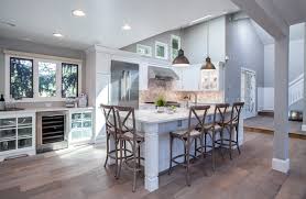 The homeowner added a medley of distinctive pulley lights from europe, and an antique dish rack dating back to 1865 that was, she says, the perfect weathered gray. White Kitchens Are Almost Always Perfect Jm Kitchen And Bath Design