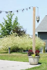 Make these diy string light poles to create a simple overhang for your backyard picnic table. Diy Planter Posts For String Lights Backyard Patio Ideas Sugar Maple Notes