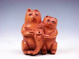 Pandawhimsical and finely carved and lacquered, contemporary ivory netsuke; Netsuke Cat Netsuke