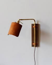 Since a lot of them are made for task lighting, they're perfect for the kind of light you typically need when you're lying in bed. Ava Wall Sconce Tan Plug Lostine