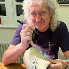Signed Brian May photo donated to 'Wheelchair for Ricky' fundraiser