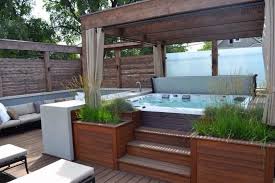 Wooden Deck With Hot Tub Retreat Using Wooden Pergola With Curtain And Outdoor Seating Added With Built In W Hot Tub Patio Hot Tub Landscaping Hot Tub Backyard