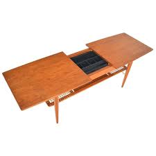 A coffee table is the focus of any living room furniture layout and creates the perfect spot for entertaining. Danish Modern Extendable Teak Coffee Table With Storage Teak Coffee Table Coffee Table With Storage Surfboard Coffee Table