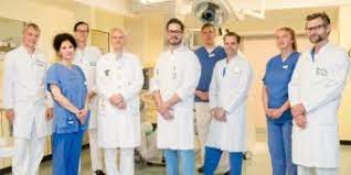 Signs include loss of consciousness and abnormal or absent breathing. Hanseatisches Cardiac Arrest Center Asklepios Klinik St Georg