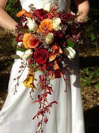 Sure, growers are now able to fly almost anything in from the other side of the world, but you'll pay a premium for that service and transport. Red And Orange Wedding Bouquets Novocom Top