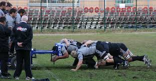 A rugby scrum restarts a rugby game after a minor infringement of the rules. Scrum Machine Wikipedia