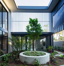 A slatted arbor shades a sitting area at one of this courtyard. Outdoor Courtyard July 2021 Houzz Au