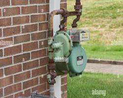 Image of Natural gas meter on the side of a house