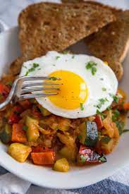 Recipe Eggs With Summer Tomatoes Zucchini And Bell Peppers Recipe Stuffed Peppers Mediterranean Diet Breakfast Recipes