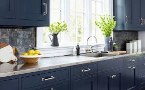 Navy Blue Custom Cabinetry With Stainless Steel Countertop And Sink Large Open Windows To Allo Contemporary Kitchen Kitchen Design Trends New Kitchen Cabinets