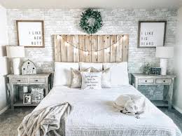 This Master Is B E D R O O M Goals With Twinkly Lights Grey Brick Accent Wall And A Wooden Headboard Bedroom Headboard Brick Wall Bedroom Rustic Bedroom
