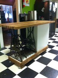 The clutterbuster powerfully transforms simple door hinges into dynamic storage space. Kitchen Island Made From Old Metal Sewing Machine Base And Leftover Drawers Then Added A Butcher Block T Old Sewing Machine Table Sewing Table Sewing Machine