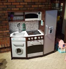 Even my 7 and 11 year olds like to play with it. Kidkraft Large Play Kitchen With Realistic Lights And Sounds Espresso Silver Walmart Com Walmart Com
