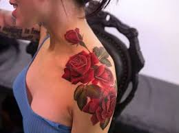 Black rose tattoos done beautifully on her back with thorns and black leaves. Rose Tattoos For Women Ideas And Designs For Girls
