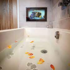 When turned on, the tv magically appears through the glass, and when turned off, it vanishes completely. Our Mortgaged Home On Instagram Waterproof Tv Small Bathroom Ideas Rose Petals Bath Small Bathroom Waterproof Tv Bathroom