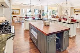 This kitchen touts white cabinets—making the black paneled wall a stunning accent that doesn't overpower the room. 27 Amazing Double Island Kitchens Design Ideas Designing Idea