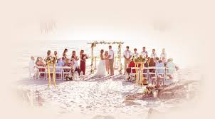 A heart drawn in the sand, with both names in the heart. Anna Maria Island Weddings Beach Wedding Ceremony The Sunset