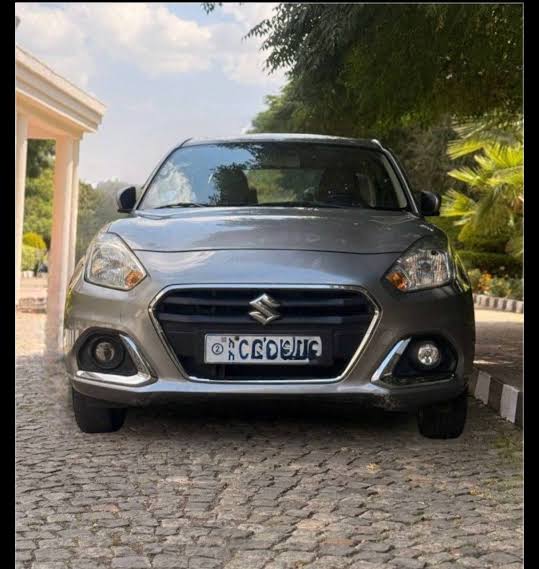 Front view of the brand new 2023 Suzuki Dzire (AGS) in Magma Grey Metallic, AI generated
