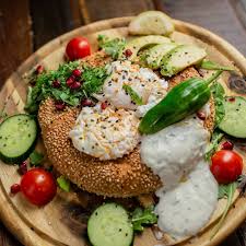 Long faux oak tables are neatly lined on. Cafe Buur Hall Of Fame Simit Love 1001 Tag Pochierte Eier Minz Joghurt Simit Cherrytomaten Chiliol Granataopfel Taboulle Avocado My Brunch Is Better Than Yours