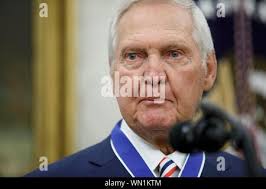 The Los Angeles Lakers' Jerry West moves the ball around Jim Washington and Bob  Boozer, right, to the Chicago Bulls during the March 26, 1968 game in the  Western Division NBA playoff