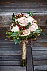 Bridal bouquet in hydrangea, baby's breath, berries and dusty millers. Petal Pick Berries For Your Bouquet Winter Wedding Flowers Christmas Wedding Bouquets Evergreen Wedding
