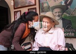 Juan Vicente poses with his family member during an interview at his place  of residence in the town of San Jose de Bolivar. Guinness World Records,  the world authority