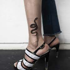 Pin By Sara Boland On Tattoos Traditional Snake Tattoo Snake Tattoo Foot Tattoos