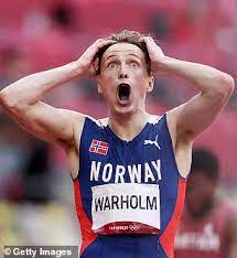 Karsten warholm of norway celebrates with his gold medal on the podium after breaking. E5 Uvzazwebfgm