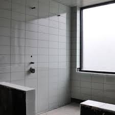 Modern bathroom tiles can be used for the entire room or define the functional zones in your bathroom or highlight bathroom fixtures. Modern House Glass Tile Bathroom Shower Life Of An Architect