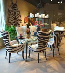 Part of the redesign is this dining room which was once a family room. Designmaster Denmark Chairs In Zebra Hair On Hide Designmaster Furniture Zebra Dining Room Zebra Dining Room Chairs African Home Decor