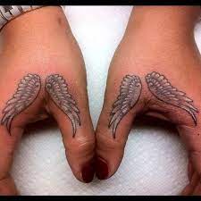 Small Angel Wings Tattoo On Fingers Tattoos Ideas Wings Tattoo Angel Wings Tattoo Tattoos